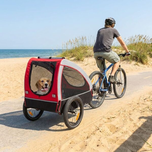 remorque velo chien 45 kg rouge au bord de l eau
