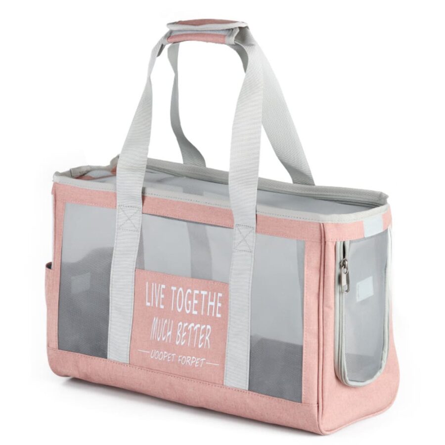 Sac de transport rose à poignées grises, fenêtres en filet, étiquette blanche avec slogan imprimé, poche zippée
