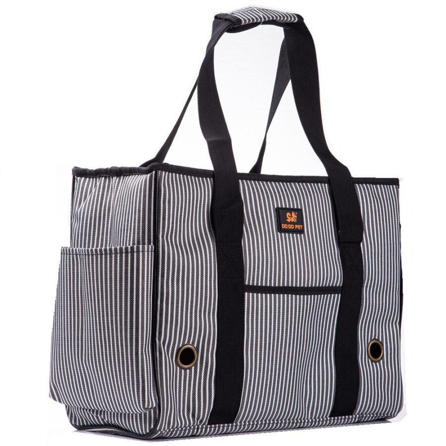 Sac de transport rayé blanc et noir à deux anses, vue trois quarts avec poche latérale et œillets métalliques